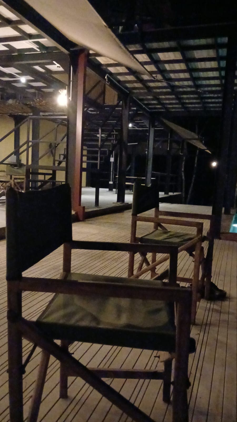 Directors chairs on the covered deck in the evening